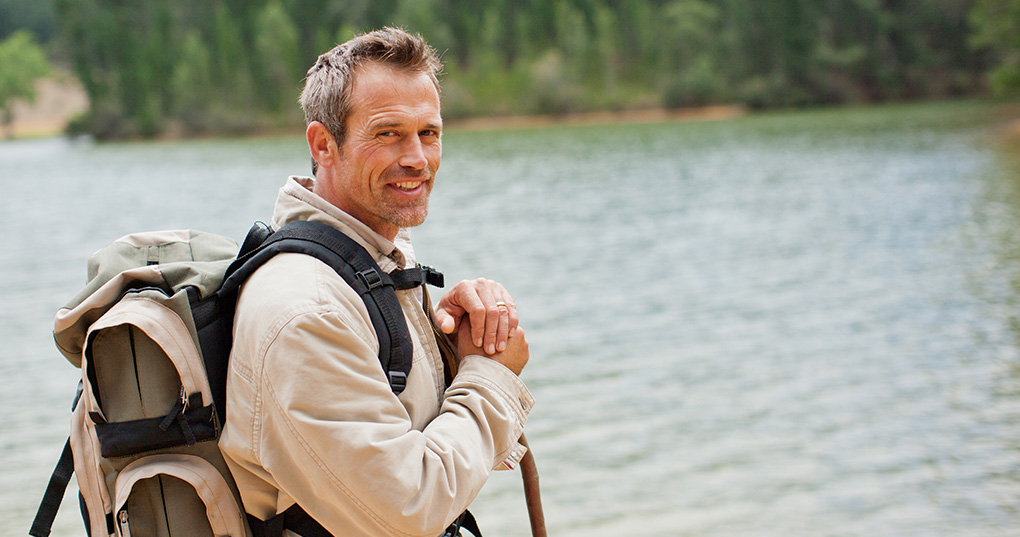 Man standing by a lake