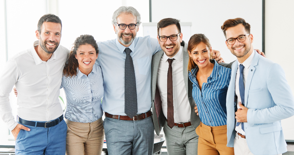 A group photo of a happy family in business together