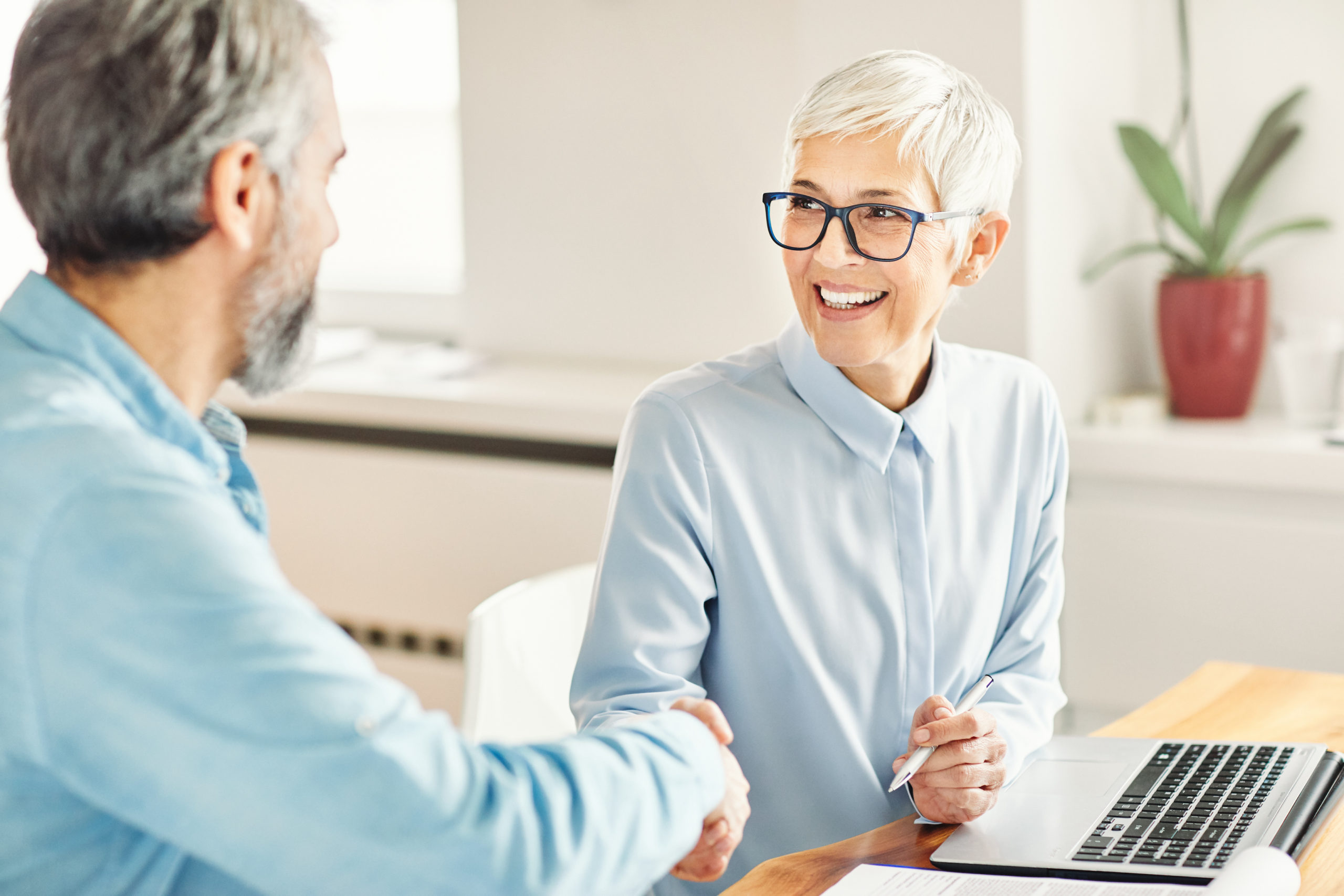 Women small business owner discusses exit strategy with a small business coach.